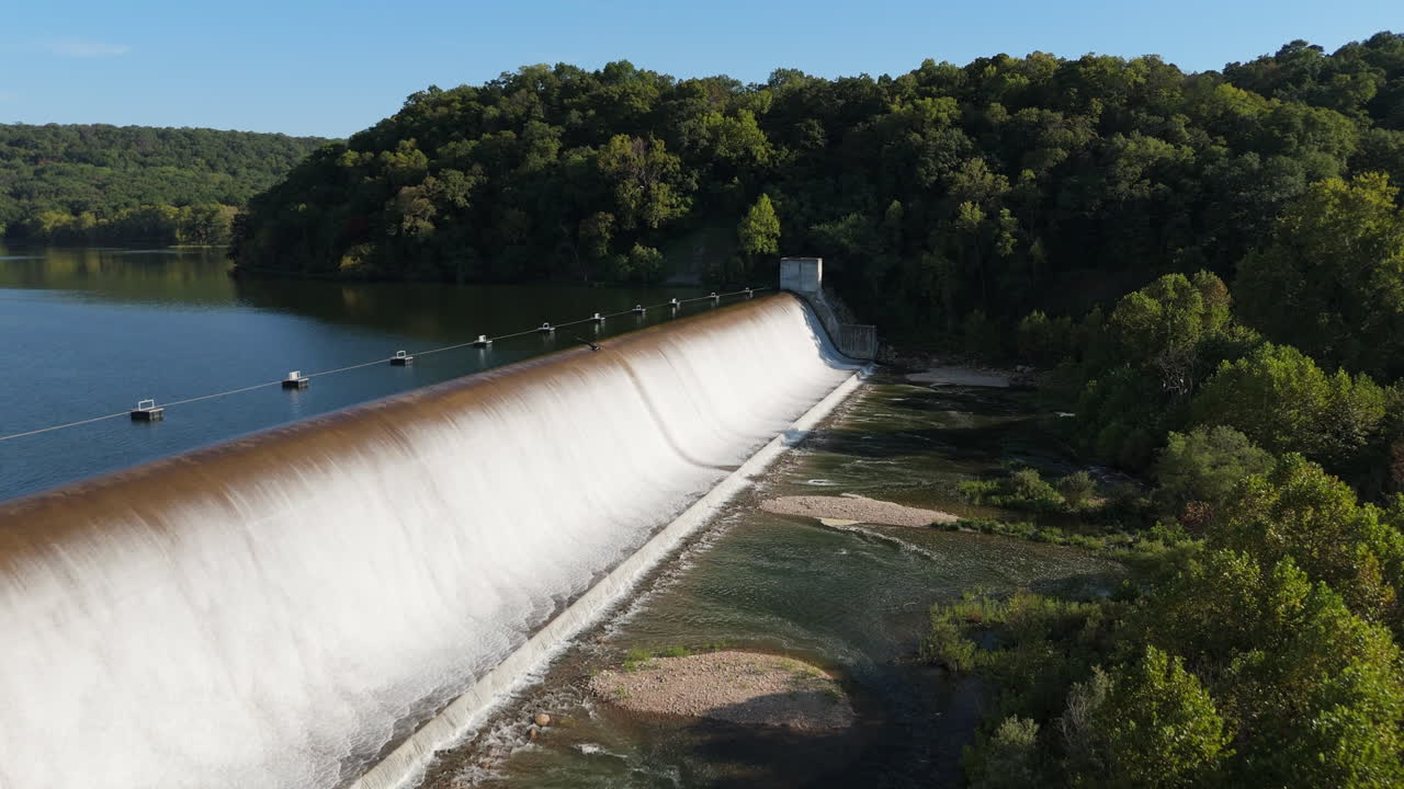 Aerial establishing of Spavinaw Spillway structure and surrounding reservoir in northeastern Oklahoma, USA