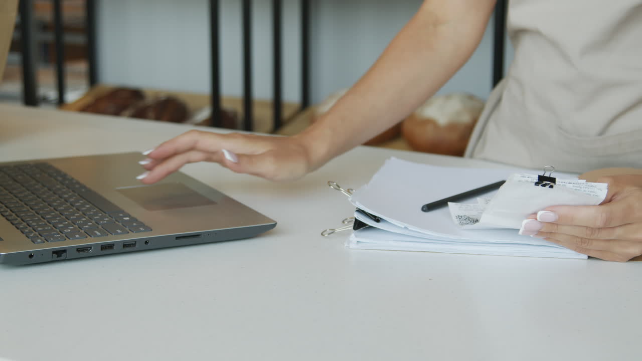 Female Counter Attendant Working in Shop