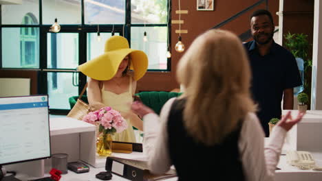 couple arriving at hotel reception