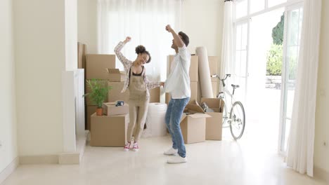 young couple dancing for joy