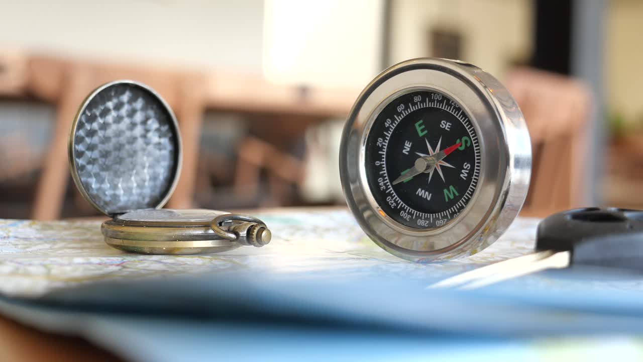 Compass and Pocket Watch on Map