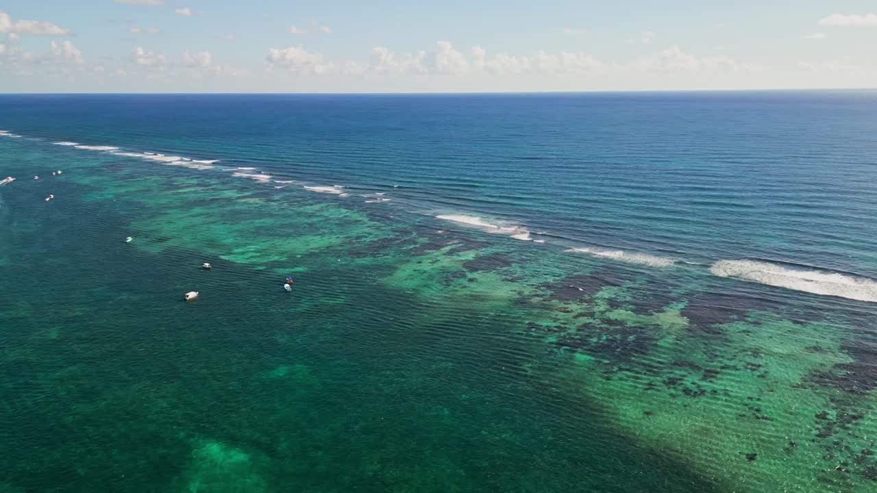 Serene aerial view of Puerto Morelos, turquoise Caribbean waters, calm vibes