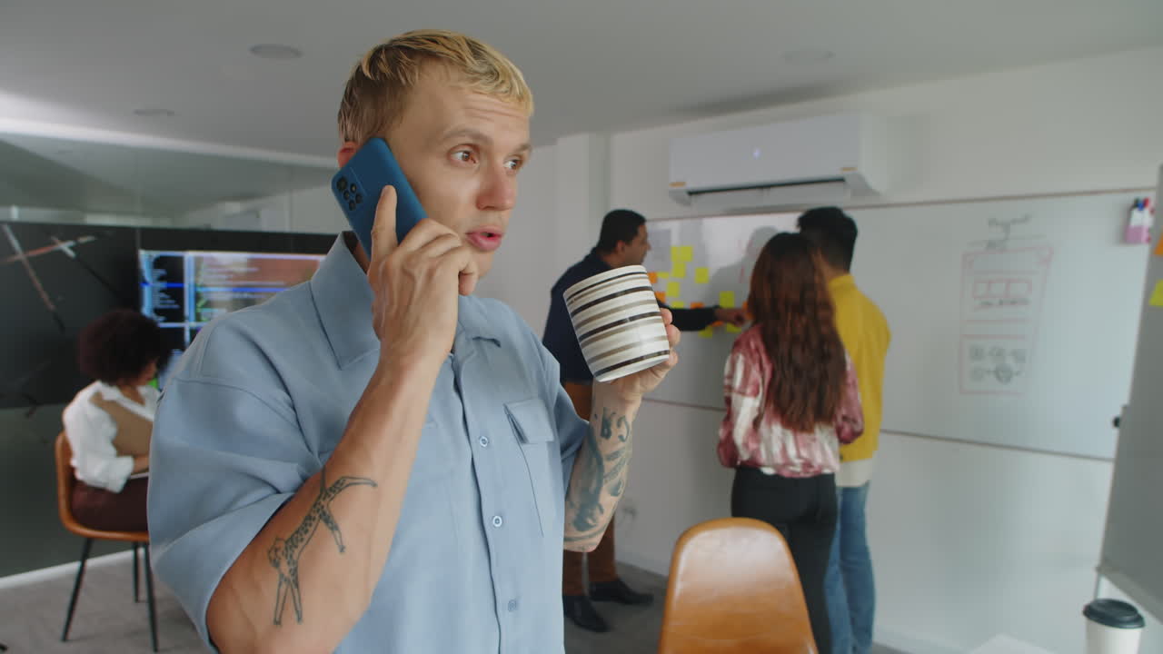 Confident Manager Calling Client on Phone and Drinking Tea