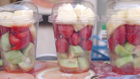 fresh fruit salad in plastic cups