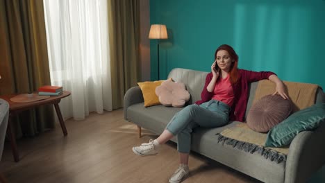 woman talking on phone in living room and laundry room