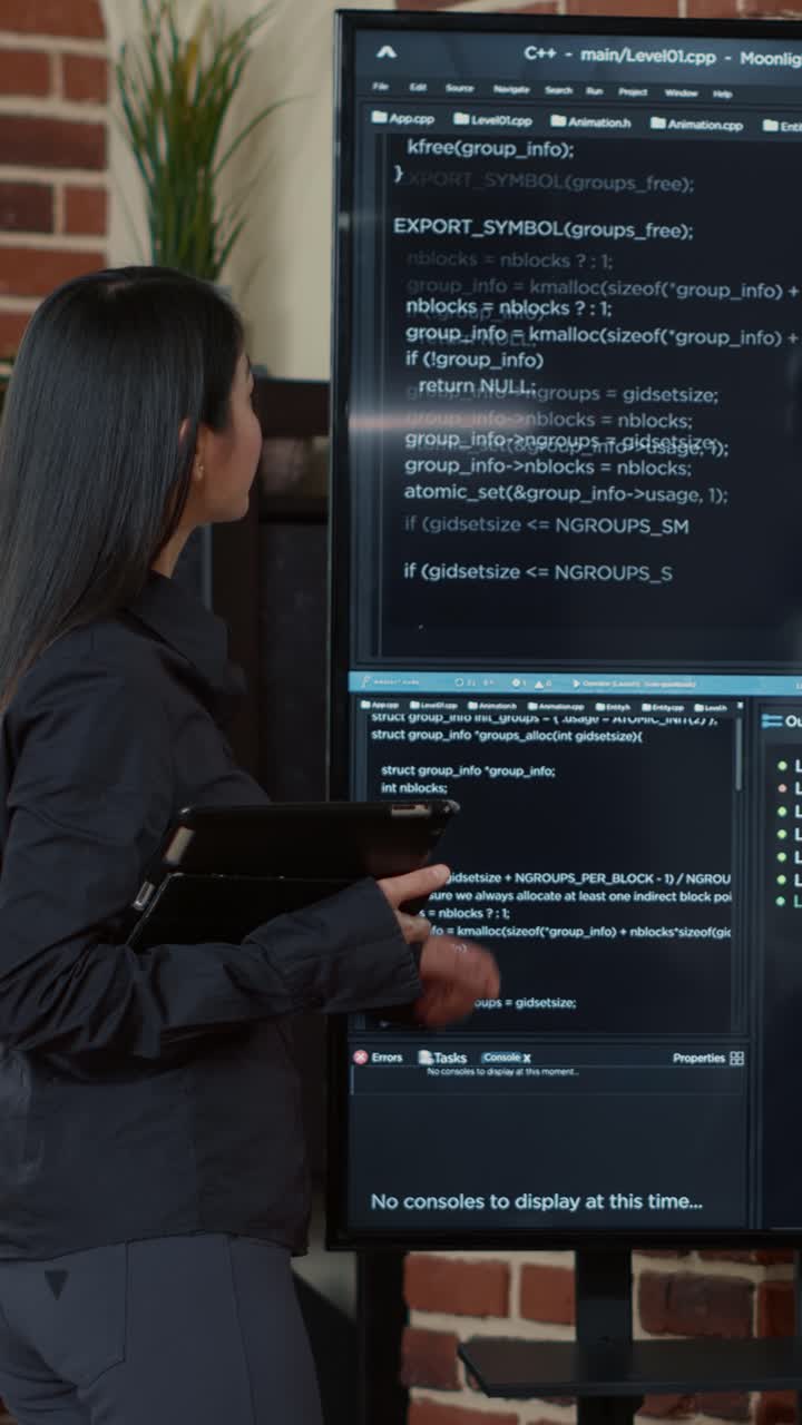 Woman presenting code on a screen