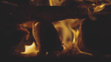 macro shot of logs burning in a fire pit