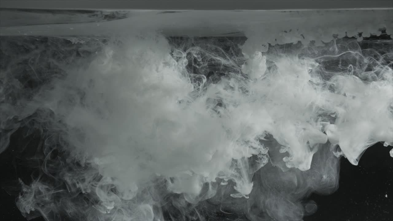 Slow motion ink flowing in water for use with visual effects and-or texturing and design