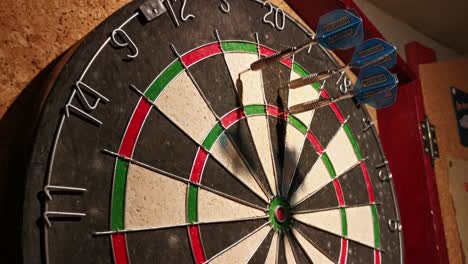 three dart arrows hitting 85 points on an old basement dart board