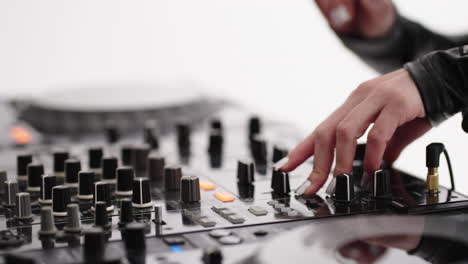 dj mixing music on a mixer