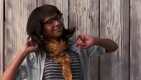 hipster posing against wooden fence