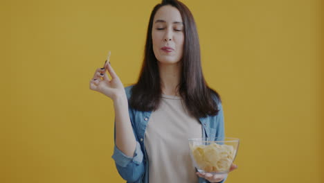woman eating potato chips