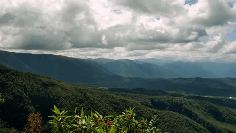 Bolivian-valleys-surrounded-by-green-hills-and-mountains-with-cloudy-skies