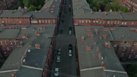 Redbrick-Apartments-And-The-Church-Of-Saint-Anne-In-Nikiszowiec,-Katowice,-Poland