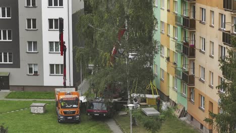 construction work with trucks and cranes in a residential area