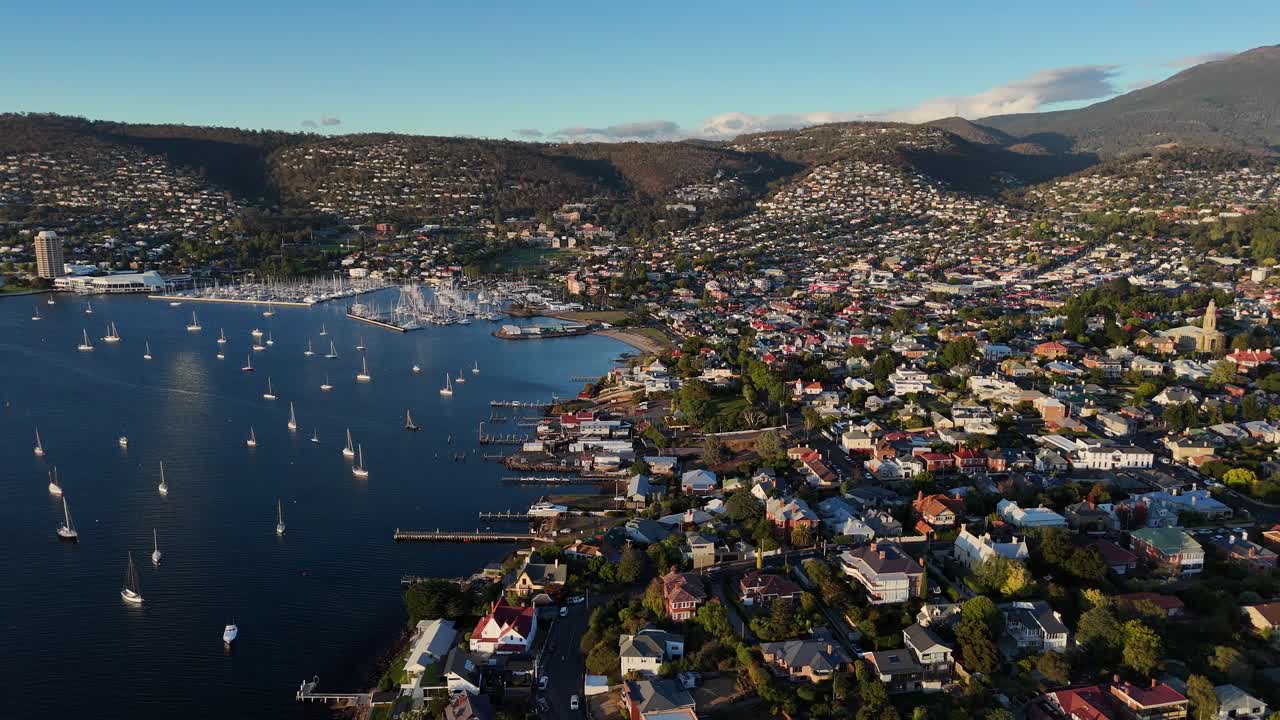 Sailboats at Sandy bay in Hobart city during sunset, Tasmania, aerial shot