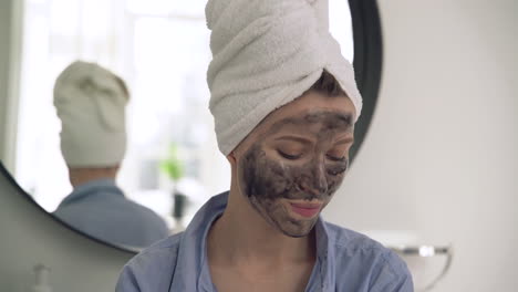 Portrait-Of-Woman-With-Facial-Mask-Looking-To-The-Camera