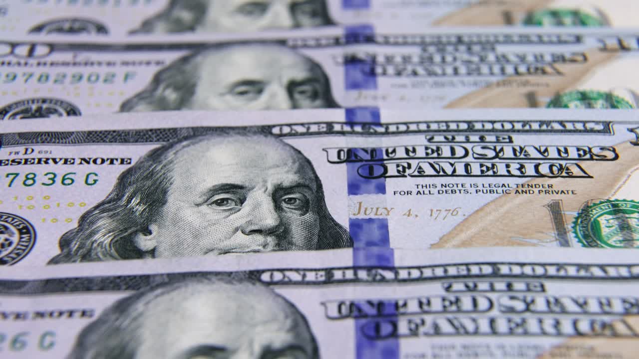 USD Dollar banknotes, paper money, exchange rate currency. Cash banknotes. The concept of finance and investment. hundred US dollars. business economics