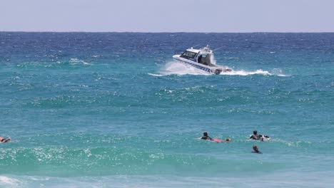 speedboat and swimmers in vibrant ocean scene