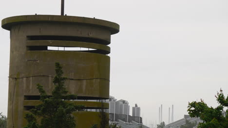 World-War-II-era-watchtower-seen-in-overcast,-rainy-weather-on-Atlantic-coast-in-time-lapsed-motion