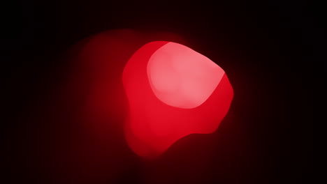 glowing red light illuminating the darkness