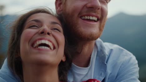 Closeup-family-faces-laughing-outdoor.-Happy-couple-having-fun-in-mountains.