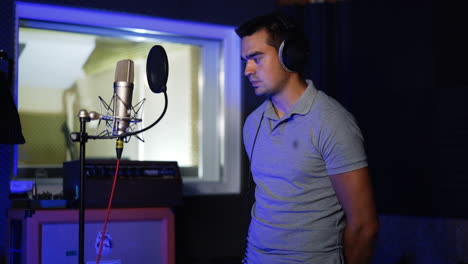 musician recording vocals in a studio