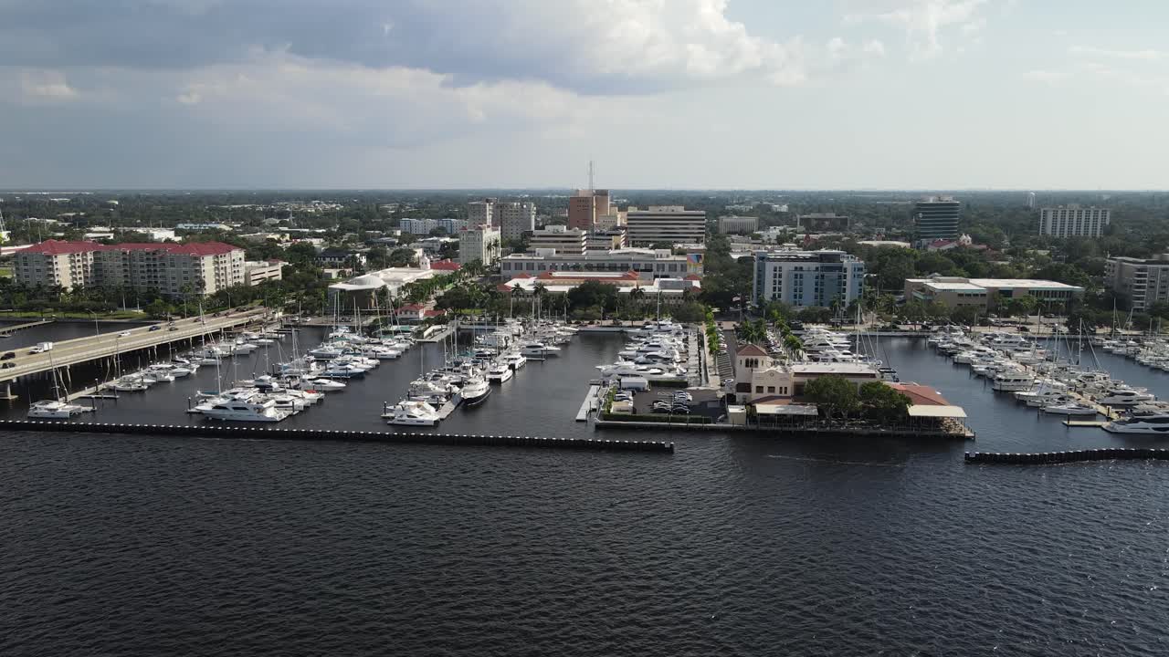 Aerial View of a City Marina with Boats and Skyscrapers
