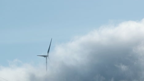 Clouds-over-a-windmill-in-Leiria,-Portugal--slow-motion