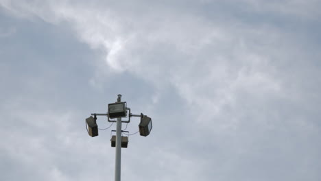 Clouds-In-The-Sky-Flying-Above-Light-Post-Outdoor---low-angle,-time-lapse