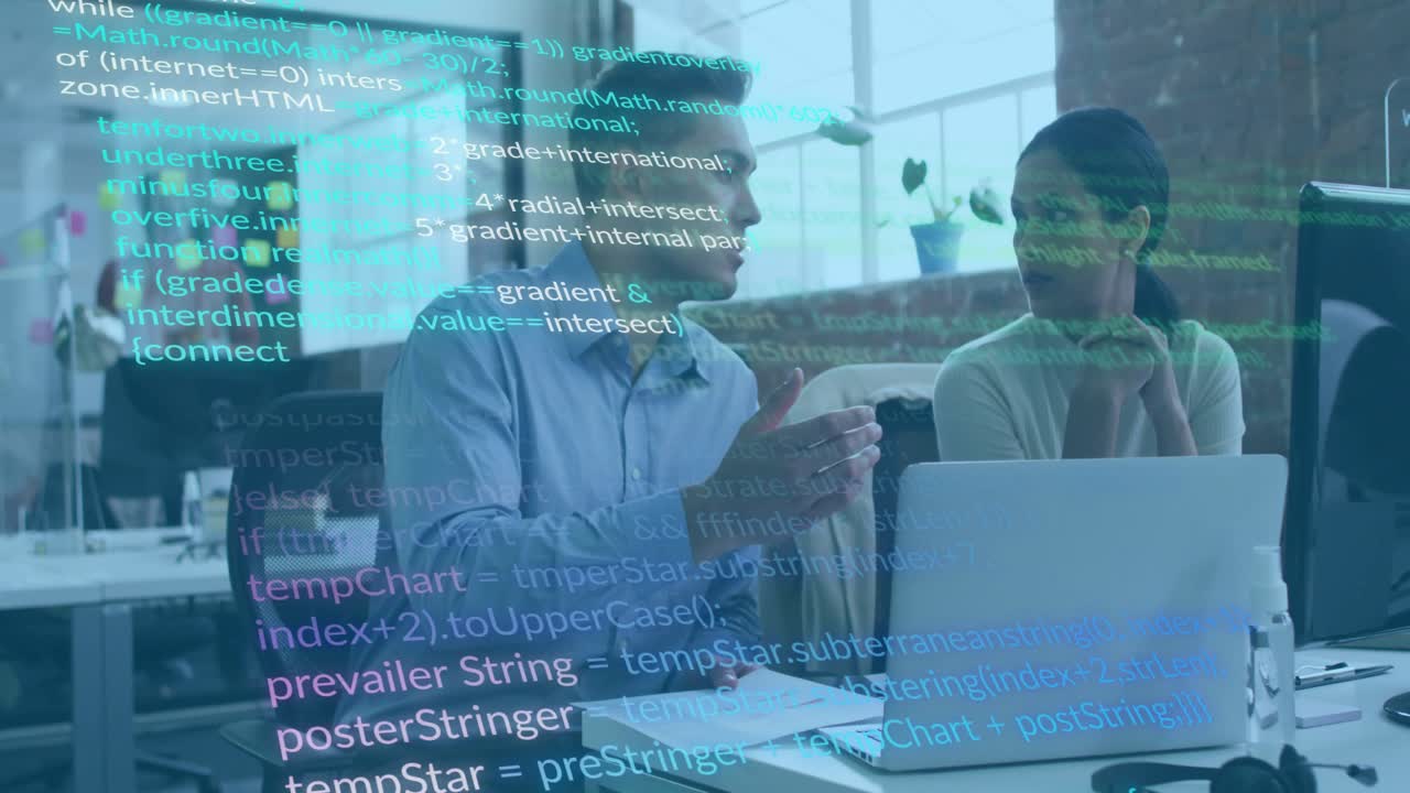 Man tapping papers and pointing to laptop, woman reviewing drifting code overlay for tech review