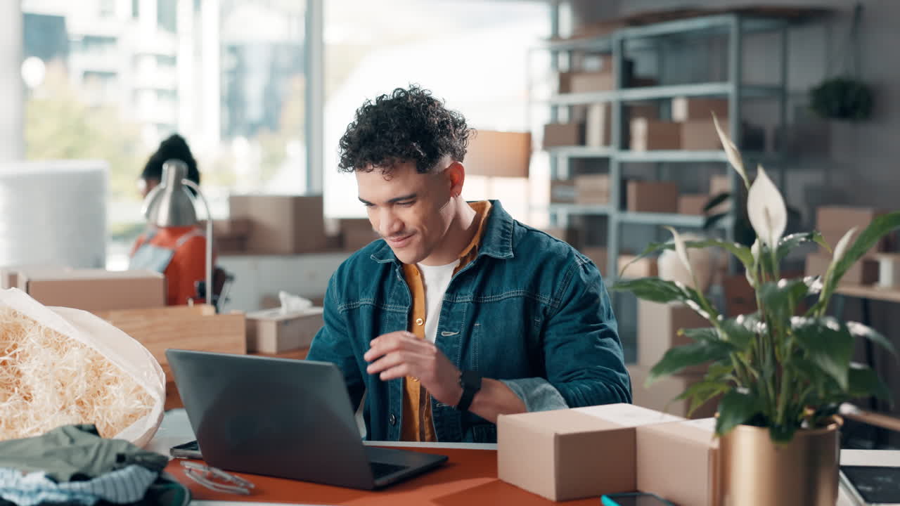 Man experiencing neck pain while working on laptop in office