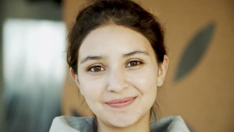 Closeup-shot-of-beautiful-young-woman-with-toothy-smile