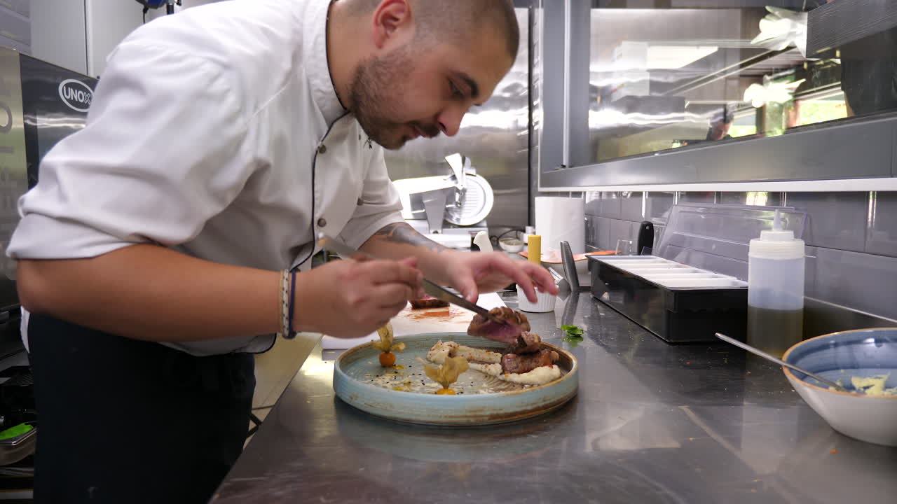 Chef meticulously preparing a gourmet dish in a restaurant kitchen