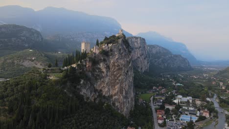 Ancient-Arco-castle-on-top-of-cliff-above-Riva-Del-Garda-city,-Trentino,-Italy