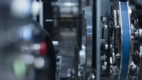 Car-tyre-production-employee-maintaining-modern-technological-machine-closeup