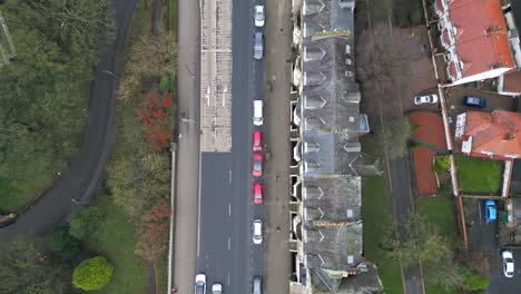 Forward-drone-shot-of-busy-streets-of-Scarborough-bay-during-daytime-in-Scarborough,-England