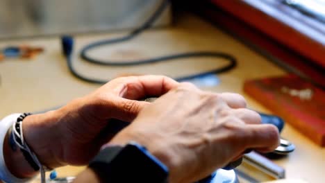 Craftswoman-working-in-workshop