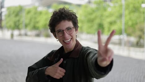 woman gesturing with hands and smiling at camera