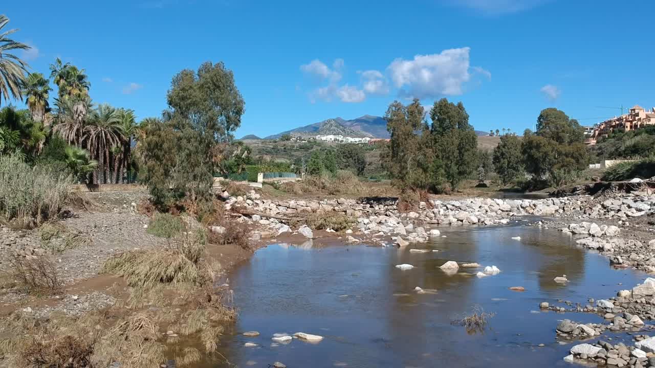 Going downstream from the river breakwater, destroyed after the recent floods in Southern Europe