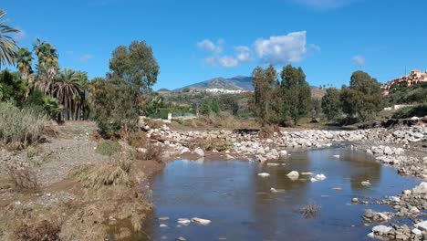 going downstream from the river breakwater, destroyed after the recent floods in southern europe