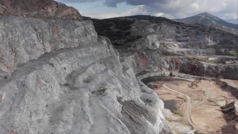 aerial drone next to to quarry steps cloudy day