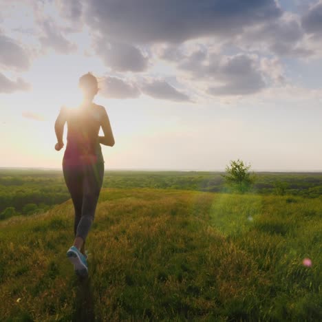 Athletic-Middle-Aged-Woman-Runs-At-Sunset