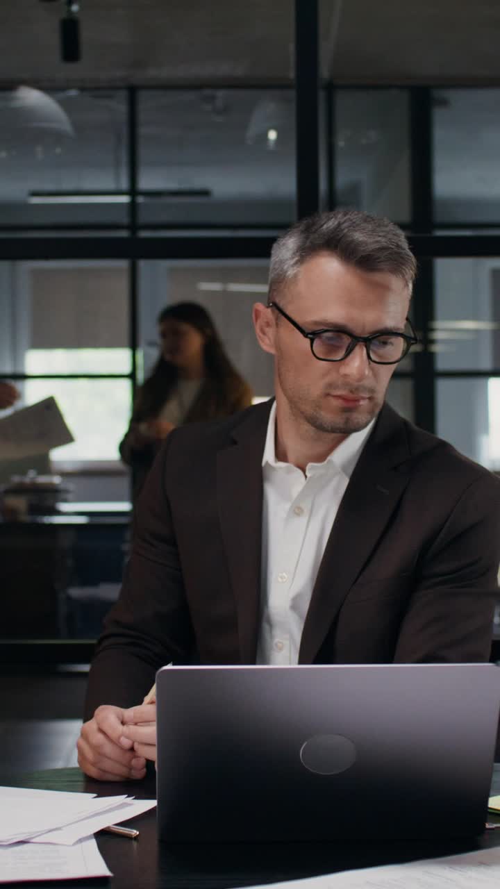 Busy Businessman in a Chaotic Office Environment