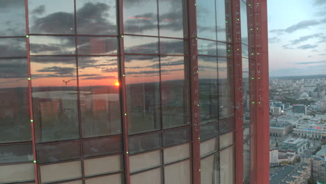 high-rise building with city views and sunset reflections