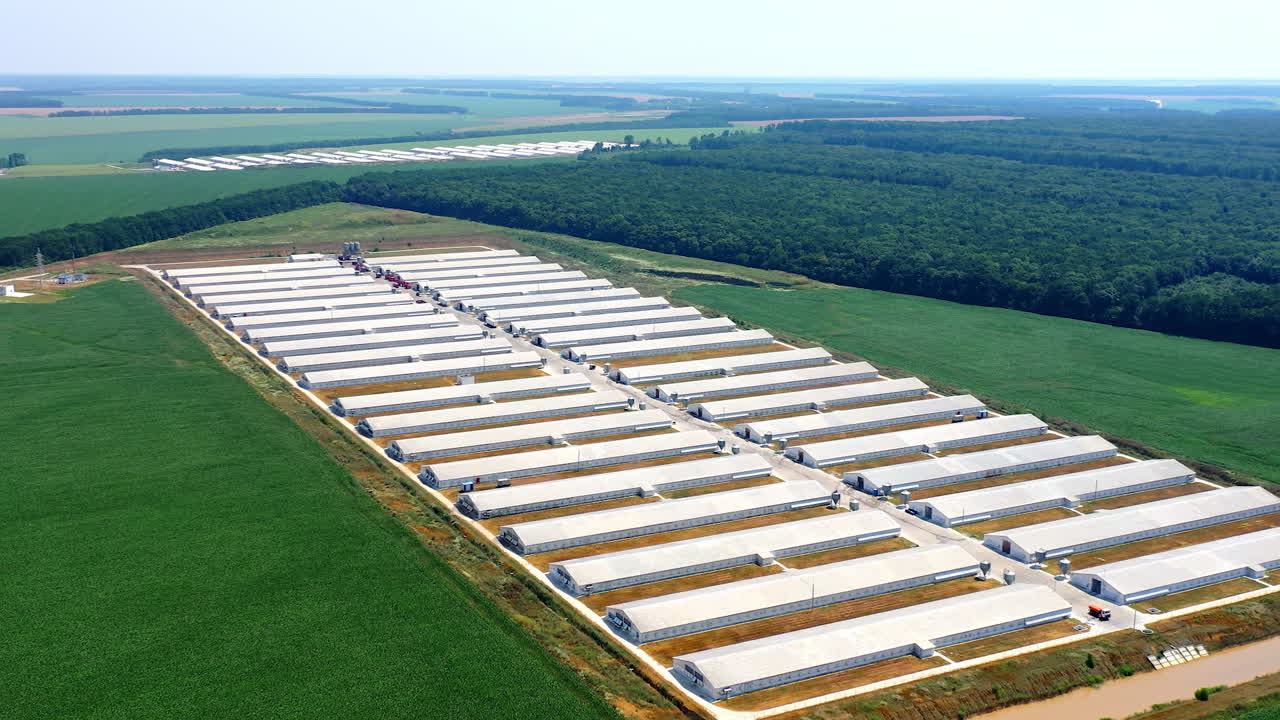 Agricultural farming buildings aerial view. Modern agriculture plant fields farm buildings.