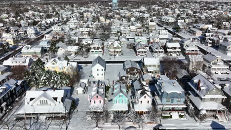 aerial of small town america covered in winter snow