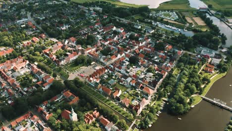 Friedrichstadt-town-in-Germany-by-River-Eider-riverside,-panoramic-aerial-view