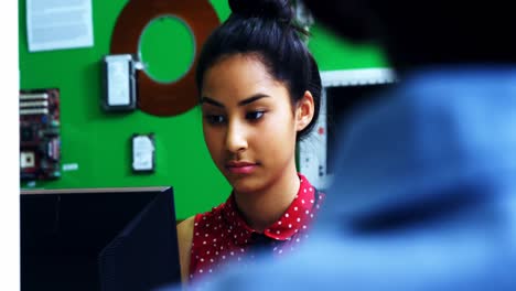 Schoolgirl-studying-on-computer-in-classroom