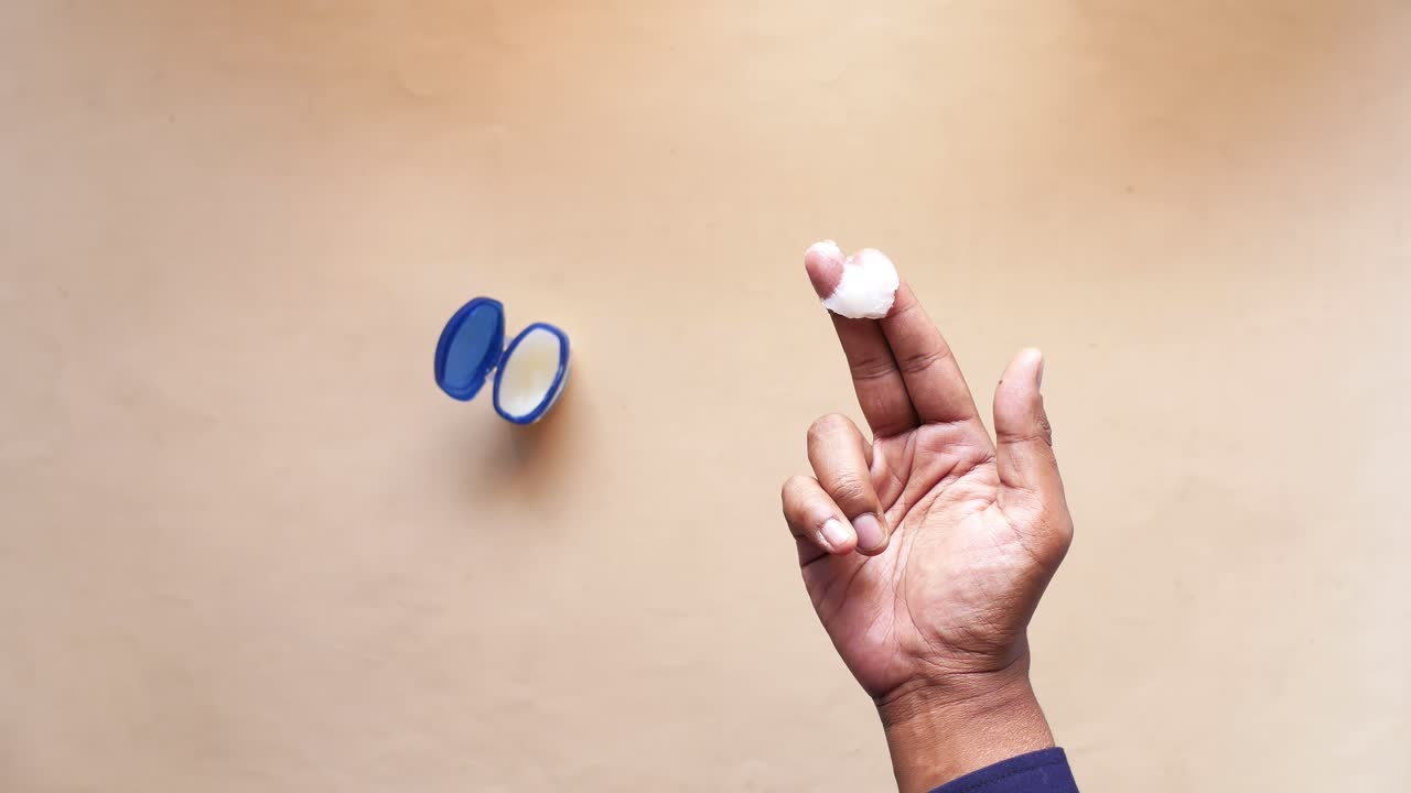 Applying Petroleum Jelly to Finger